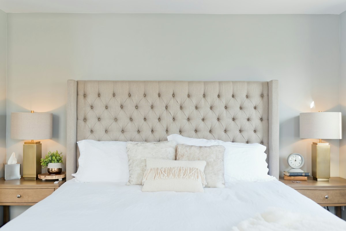 Calm bedroom with wooden bed frame and bedside storage
