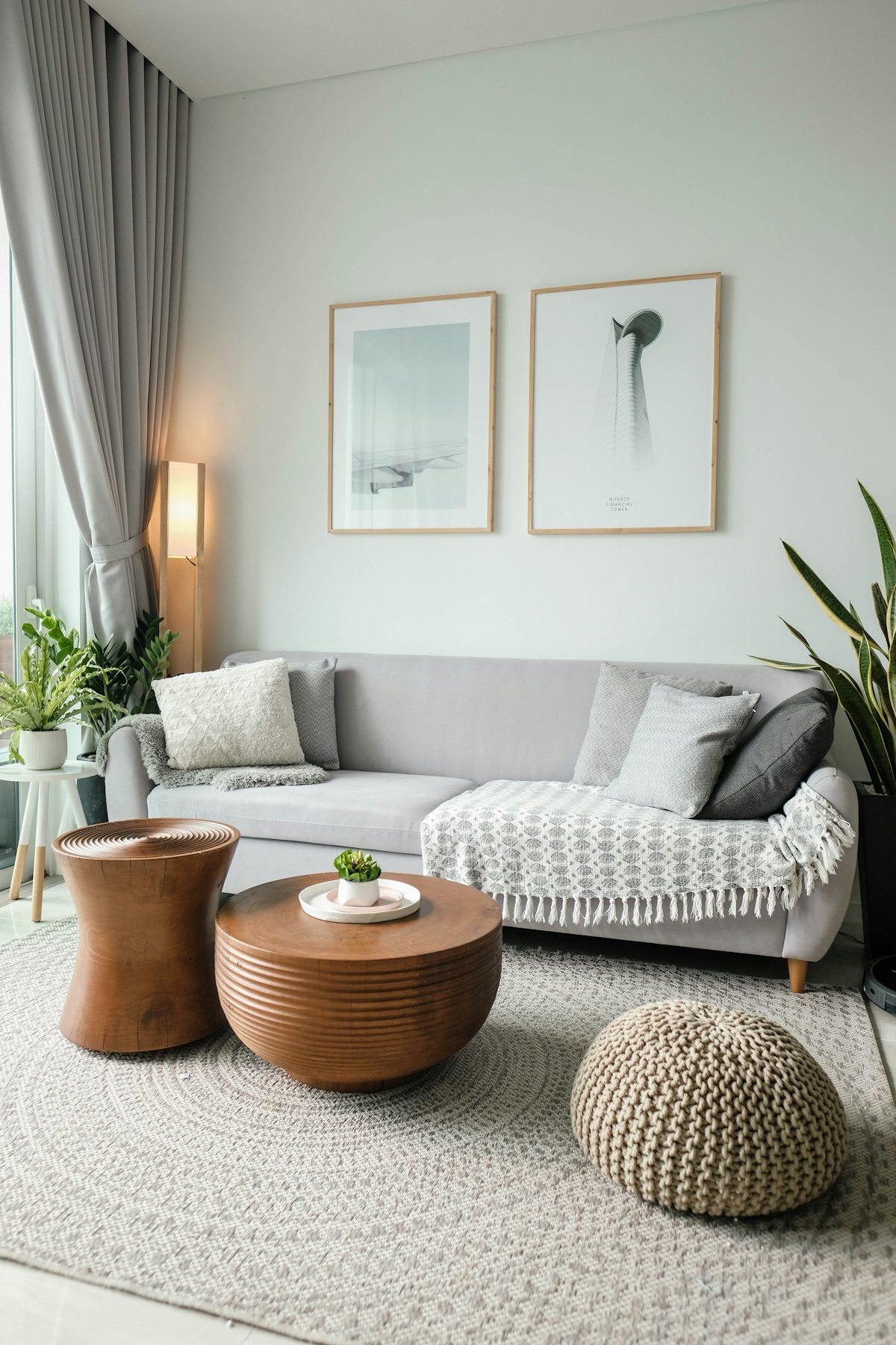 Styled wooden furniture corner with shelf, plants and seating